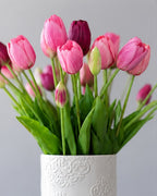 Close-up of the Tuesdays tulips above the embossed white vase
